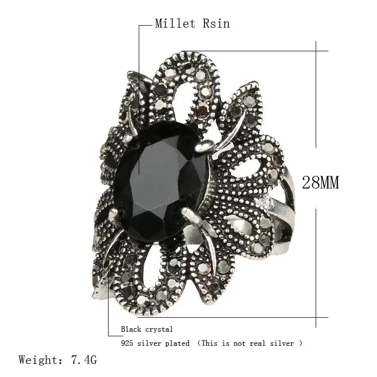 Elevate Your Style with the Women's Hollow Flower Black Crystal Ring 💎