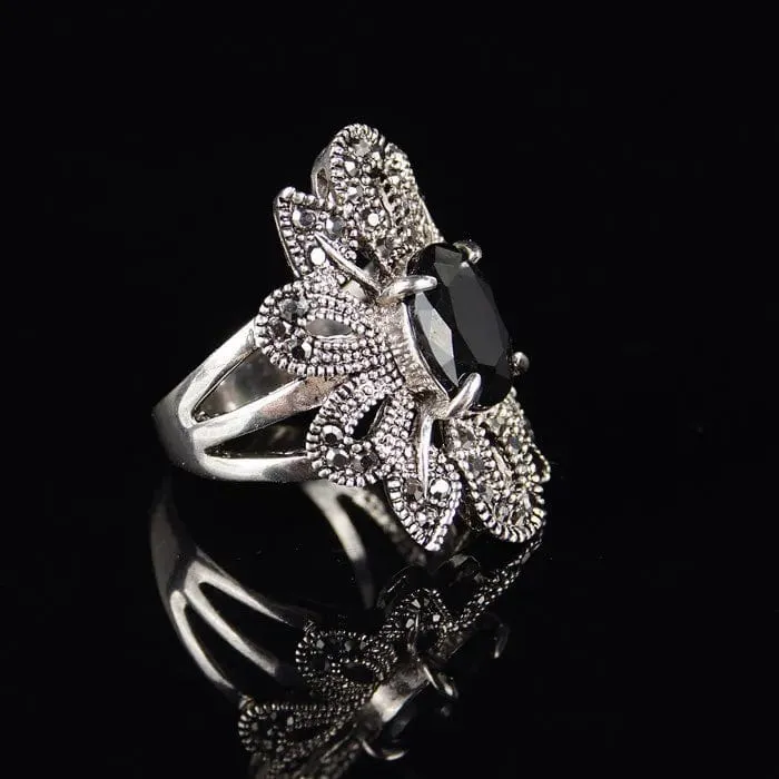 Elevate Your Style with the Women's Hollow Flower Black Crystal Ring 💎
